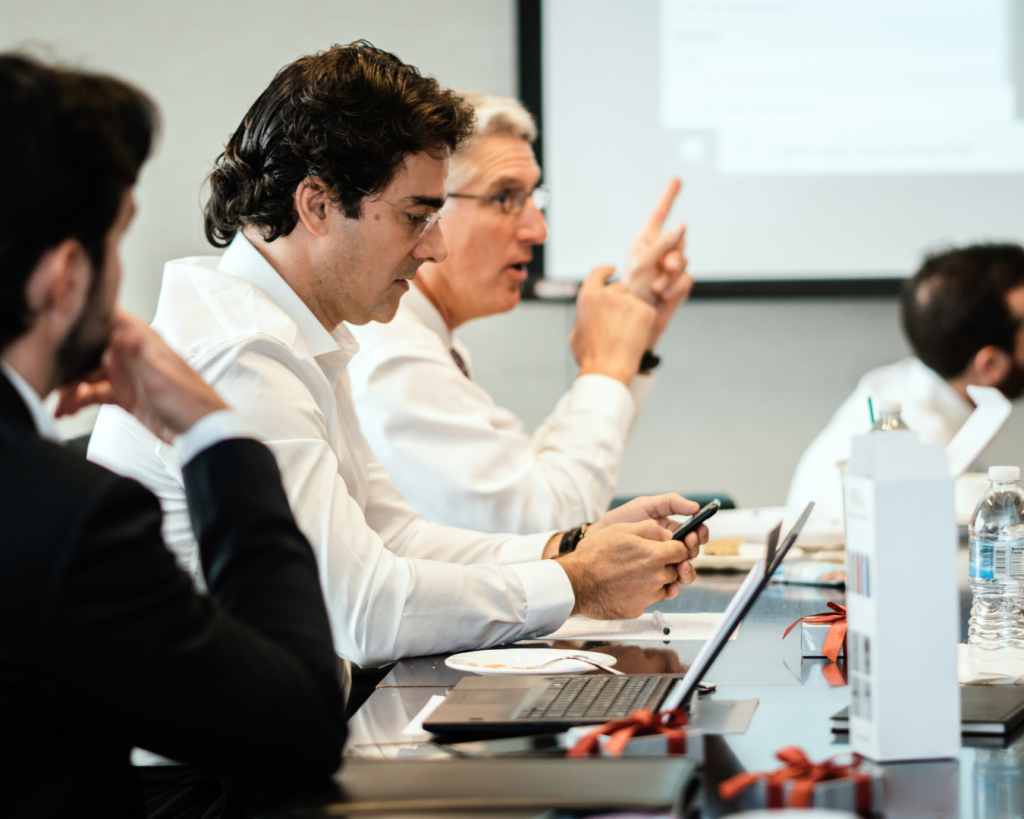 Senior business team brainstorming Custom-Made ERP requirements in modern boardroom meeting